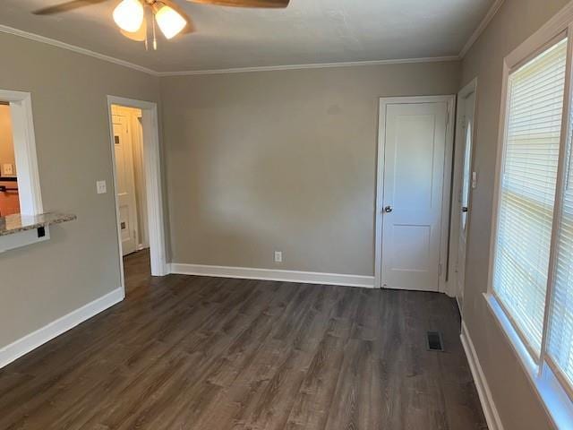 633 Tom Read Dr, Marietta, GA 30062 - unfurnished room with ceiling fan, dark wood-style floors, ornamental molding, and baseboards