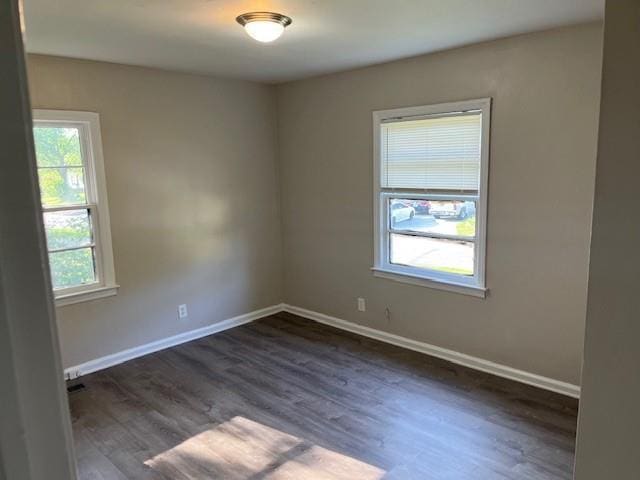 633 Tom Read Dr, Marietta, GA 30062 - empty room with baseboards and dark wood-style flooring