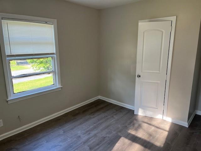 633 Tom Read Dr, Marietta, GA 30062 - spare room with dark wood-style flooring and baseboards