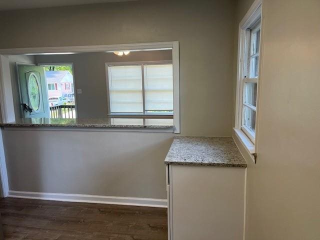 633 Tom Read Dr, Marietta, GA 30062 - unfurnished dining area featuring dark wood-type flooring and baseboards
