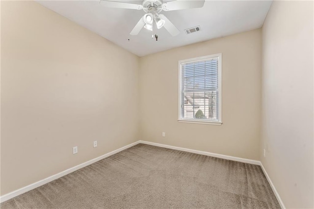 empty room featuring visible vents, ceiling fan, baseboards, and carpet