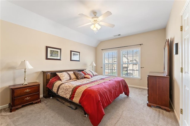 bedroom featuring visible vents, baseboards, carpet, lofted ceiling, and ceiling fan