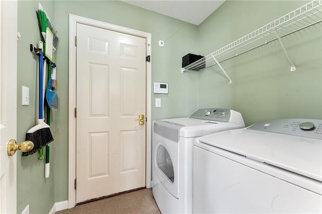 washroom featuring laundry area and independent washer and dryer