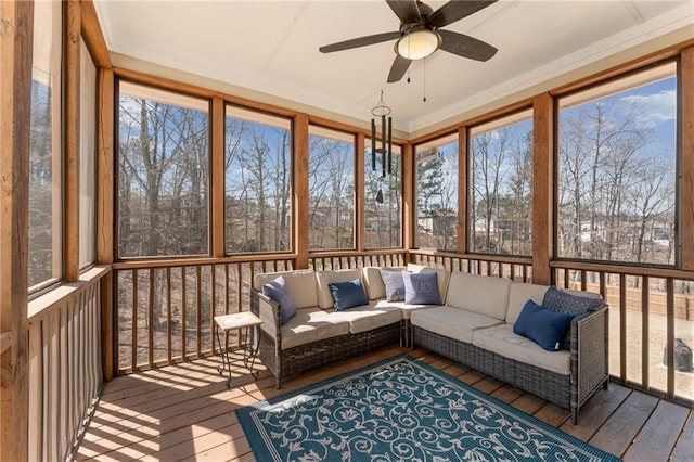 sunroom featuring ceiling fan