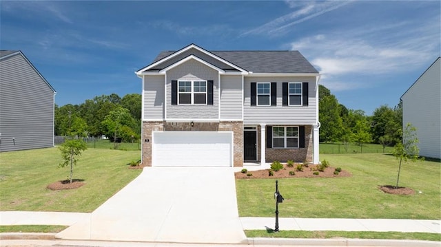 view of front of house with a garage and a front yard