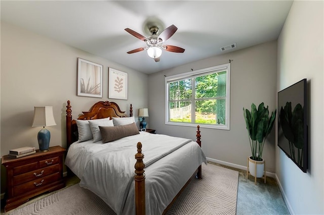 bedroom with ceiling fan and carpet flooring