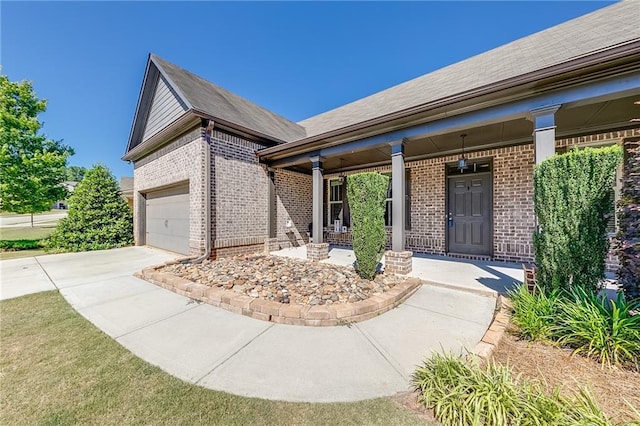 view of front of home with a garage and covered porch