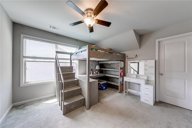 carpeted bedroom with ceiling fan