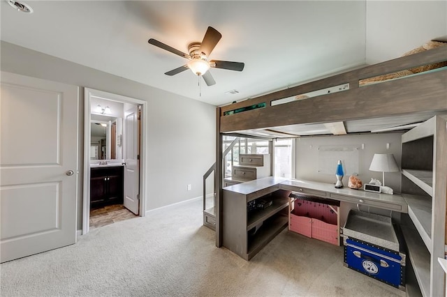 kitchen with light carpet and ceiling fan