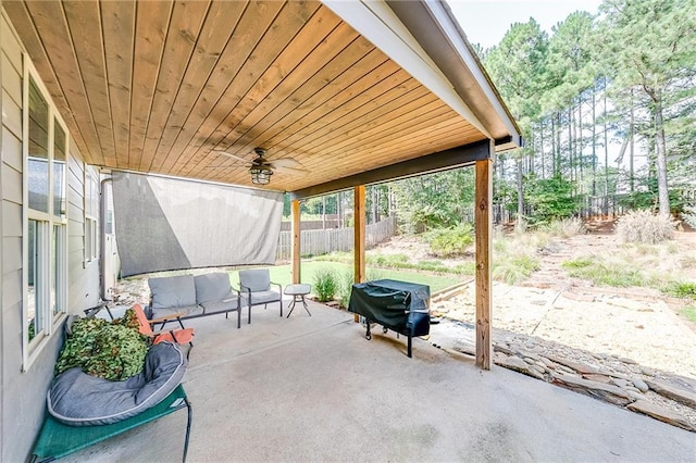 view of patio with a grill and ceiling fan