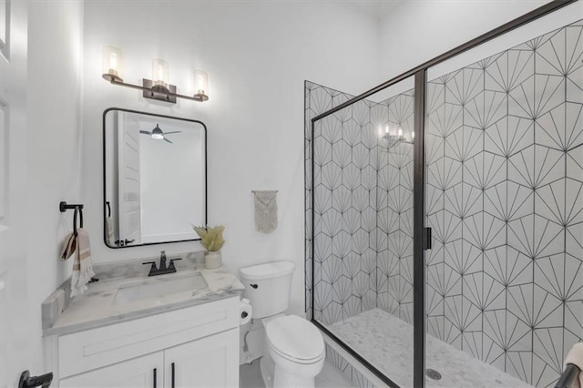 bathroom featuring walk in shower, toilet, and vanity