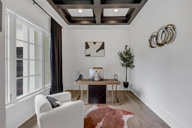 office featuring coffered ceiling, wood-type flooring, and beamed ceiling