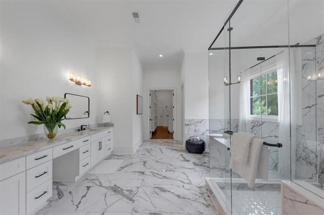 bathroom with vanity and a shower with door