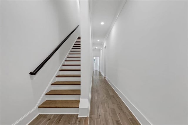 stairs with hardwood / wood-style flooring