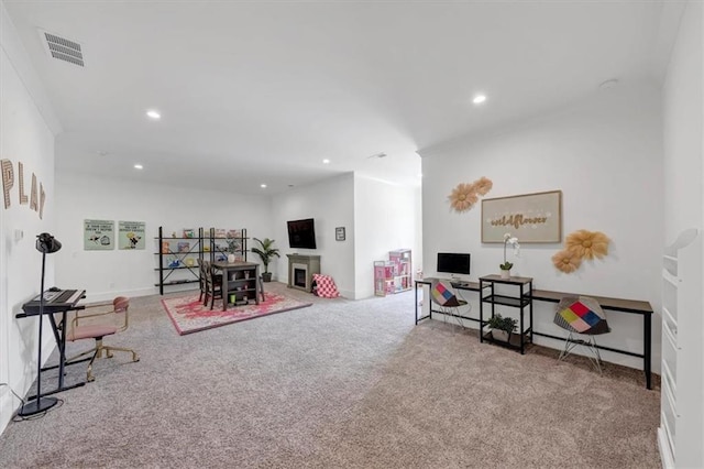 recreation room with light carpet