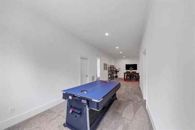 game room featuring light carpet