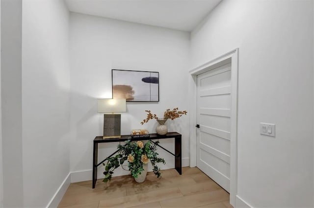 hallway with light wood-type flooring