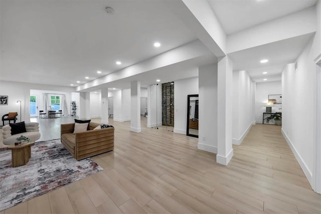 living room with light hardwood / wood-style flooring