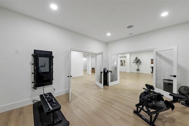 exercise area with light wood-type flooring