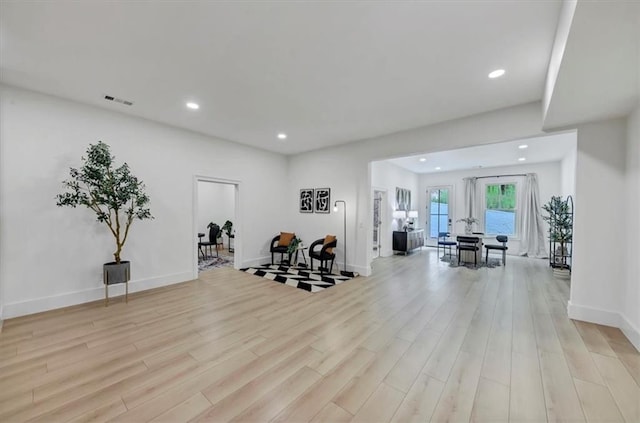 exercise room featuring light hardwood / wood-style flooring