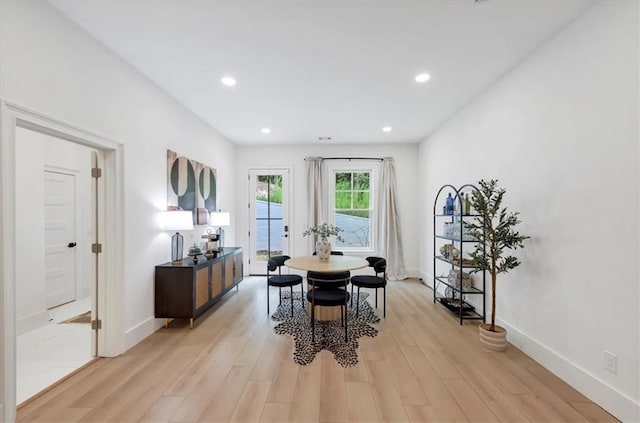 dining space featuring light wood-type flooring