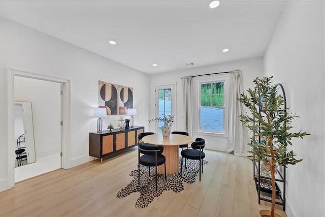 dining space featuring light wood-type flooring