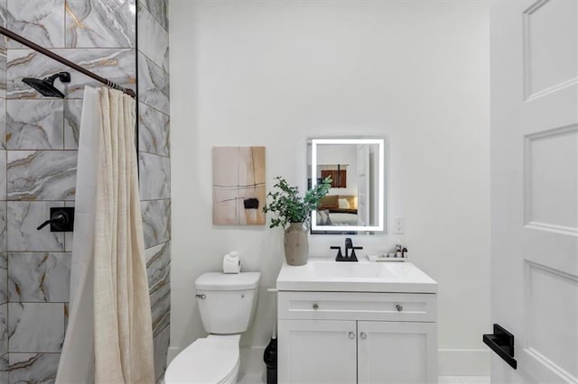 bathroom with vanity, toilet, and a shower with shower curtain