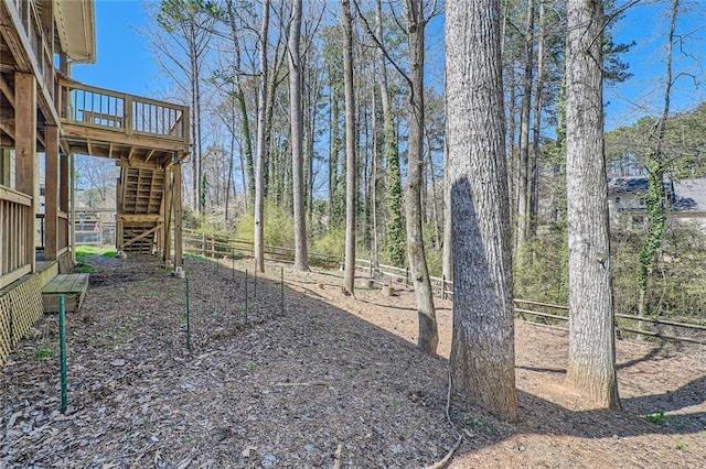 view of yard with stairway and fence