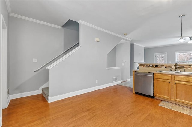 corridor with attic access, baseboards, carpet flooring, and an upstairs landing