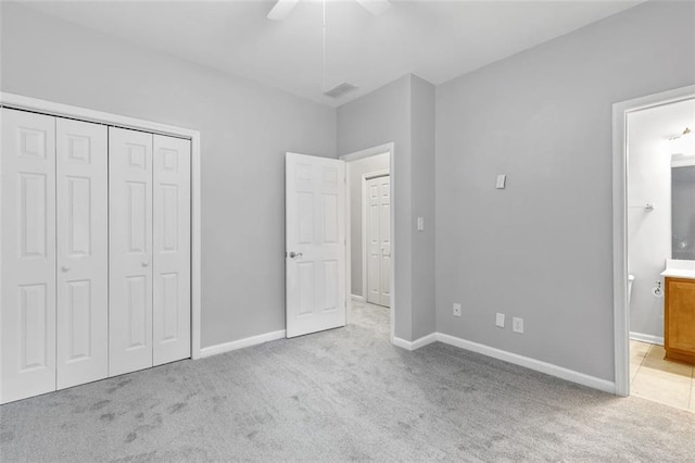 spare room featuring ceiling fan, baseboards, and carpet flooring