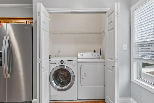 laundry area with laundry area and washer and clothes dryer