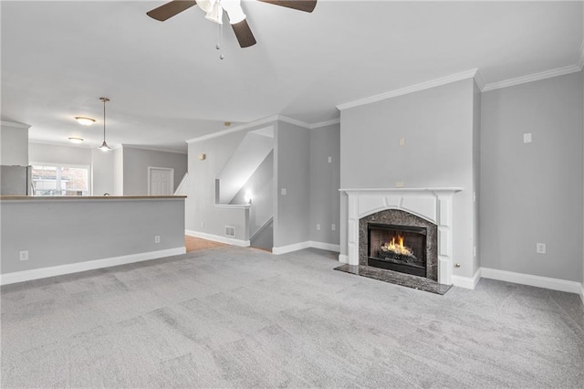 unfurnished living room with carpet floors and crown molding