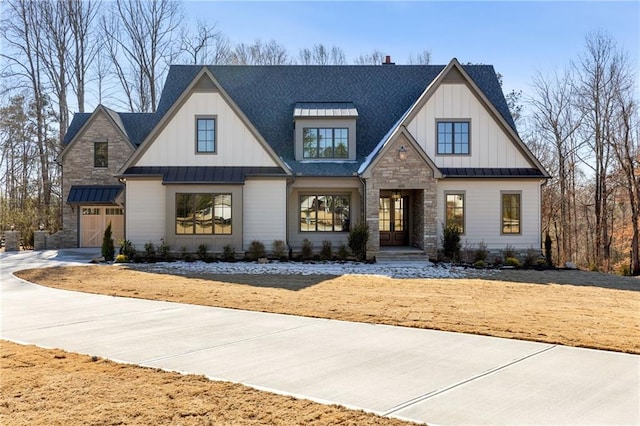 modern inspired farmhouse featuring a garage