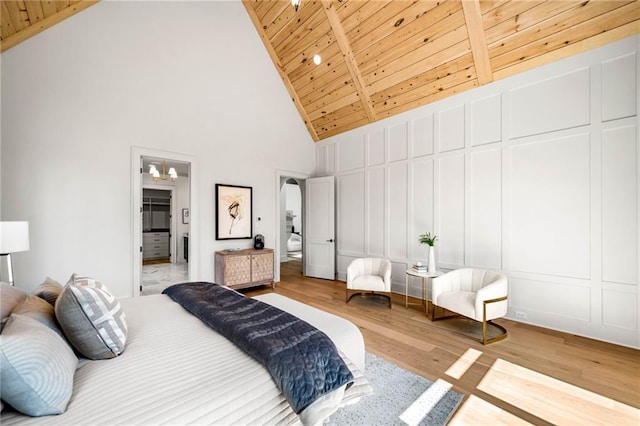 605 Claxton Ln, Milton, GA 30004 - bedroom with wooden ceiling, wood finished floors, lofted ceiling, a decorative wall, and arched walkways