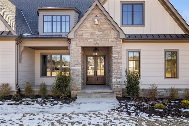 view of snow covered property entrance