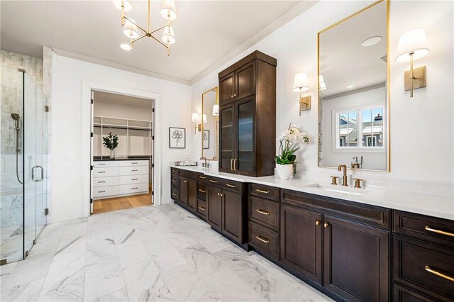 605 Claxton Ln, Milton, GA 30004 - bathroom with double vanity, ornamental molding, a sink, and a shower stall