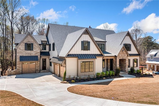 605 Claxton Ln, Milton, GA 30004 - view of front of property with stone siding, metal roof, concrete driveway, a standing seam roof, and board and batten siding