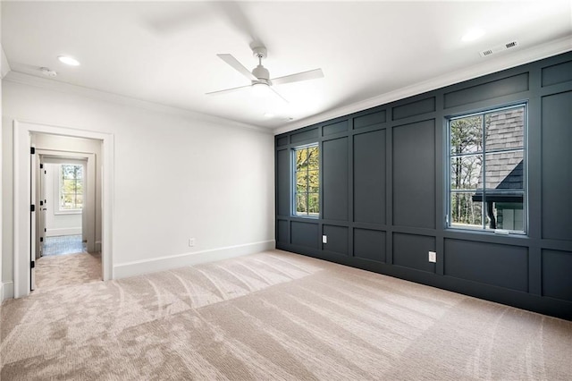 605 Claxton Ln, Milton, GA 30004 - empty room featuring light colored carpet, visible vents, ornamental molding, and a decorative wall