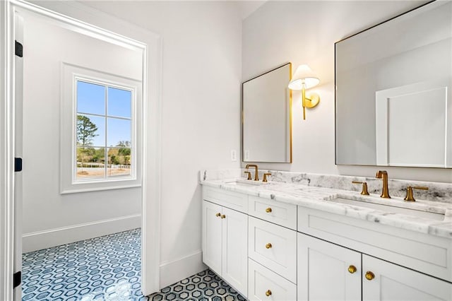 605 Claxton Ln, Milton, GA 30004 - full bathroom with double vanity, a sink, and baseboards