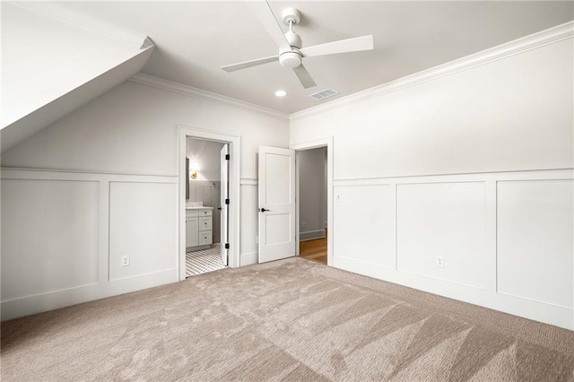 605 Claxton Ln, Milton, GA 30004 - unfurnished bedroom with crown molding, carpet floors, ensuite bath, a decorative wall, and visible vents