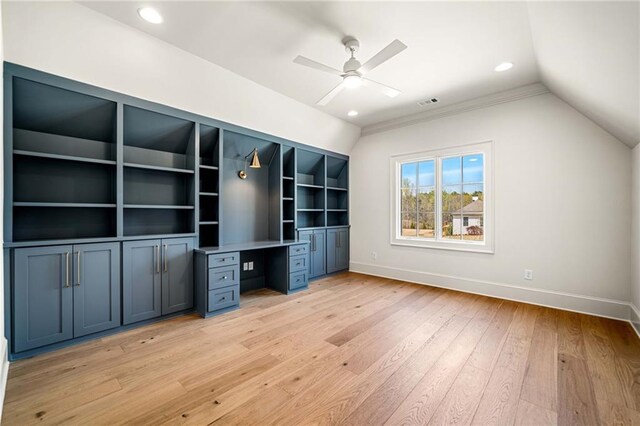 unfurnished bedroom featuring ceiling fan, light colored carpet, and crown molding