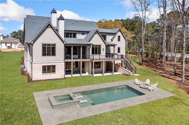 605 Claxton Ln, Milton, GA 30004 - back of property featuring a patio area, stairway, a wooden deck, a shingled roof, and a lawn