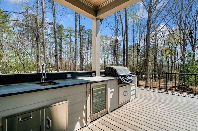 605 Claxton Ln, Milton, GA 30004 - deck with exterior kitchen, a sink, wine cooler, and grilling area