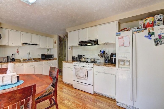 3576 Shrewsbury Ct, Snellville, GA 30039 - kitchen featuring extractor fan, white cabinets, a sink, and white appliances