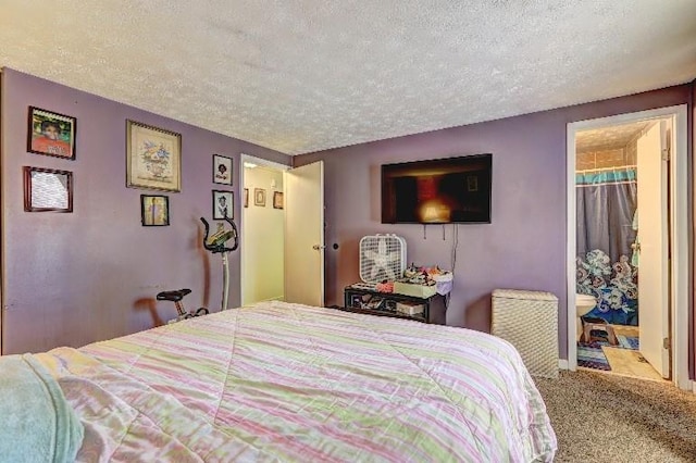 3576 Shrewsbury Ct, Snellville, GA 30039 - bedroom featuring ensuite bathroom, carpet flooring, and a textured ceiling