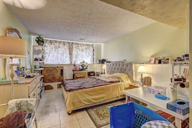 3576 Shrewsbury Ct, Snellville, GA 30039 - bedroom featuring a textured ceiling and light tile patterned floors