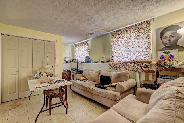 3576 Shrewsbury Ct, Snellville, GA 30039 - living room featuring a textured ceiling, visible vents, and light tile patterned floors