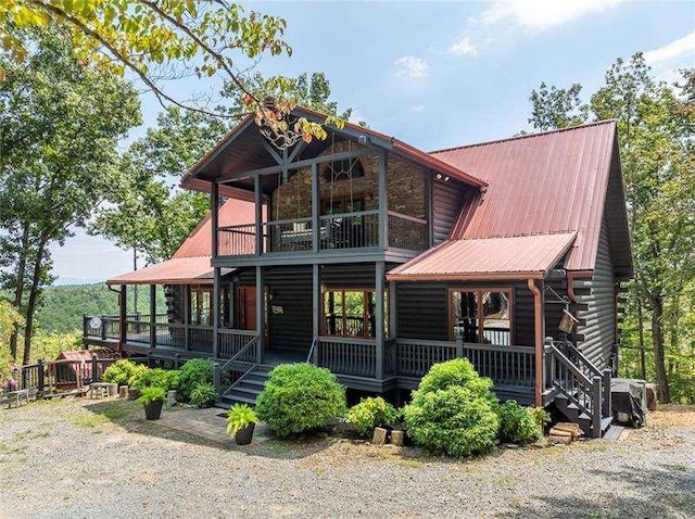 1363 Foxhound Trl, Ranger, GA 30734 - view of front of home featuring a balcony, a metal roof, and covered porch