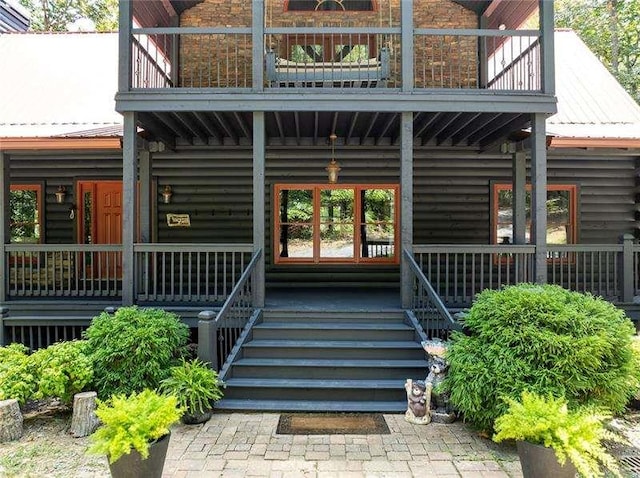 1363 Foxhound Trl, Ranger, GA 30734 - doorway to property with a balcony, a porch, a metal roof, and log siding
