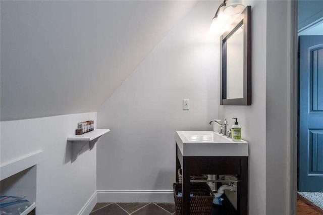 1363 Foxhound Trl, Ranger, GA 30734 - bathroom with vanity, vaulted ceiling, and tile patterned flooring